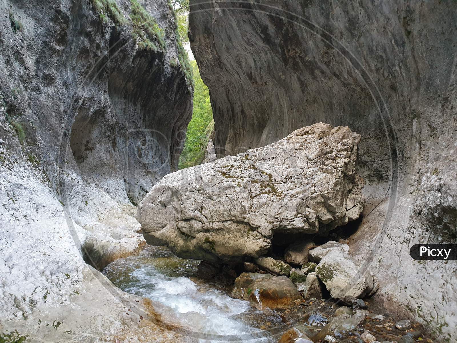 Huge Limestone Boulder In Cheile Rametului River