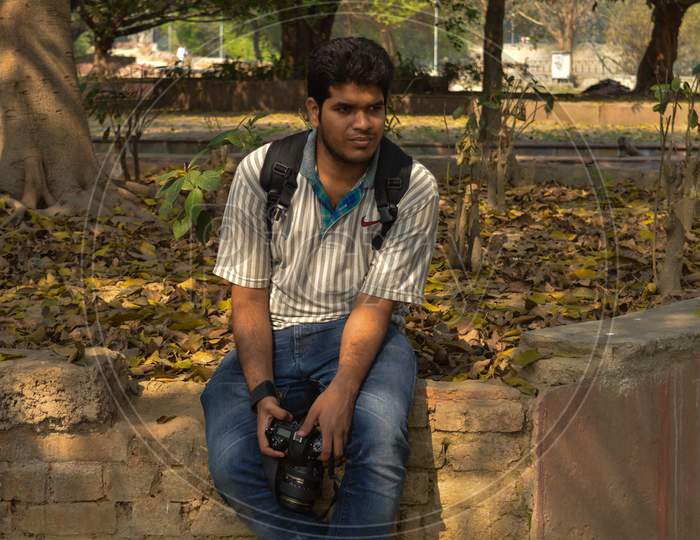 A Indian Guy,Boy With Nikon Camera D750 Doing Photo Shoot And Posing Inside Of Garden And Lake At Morning.