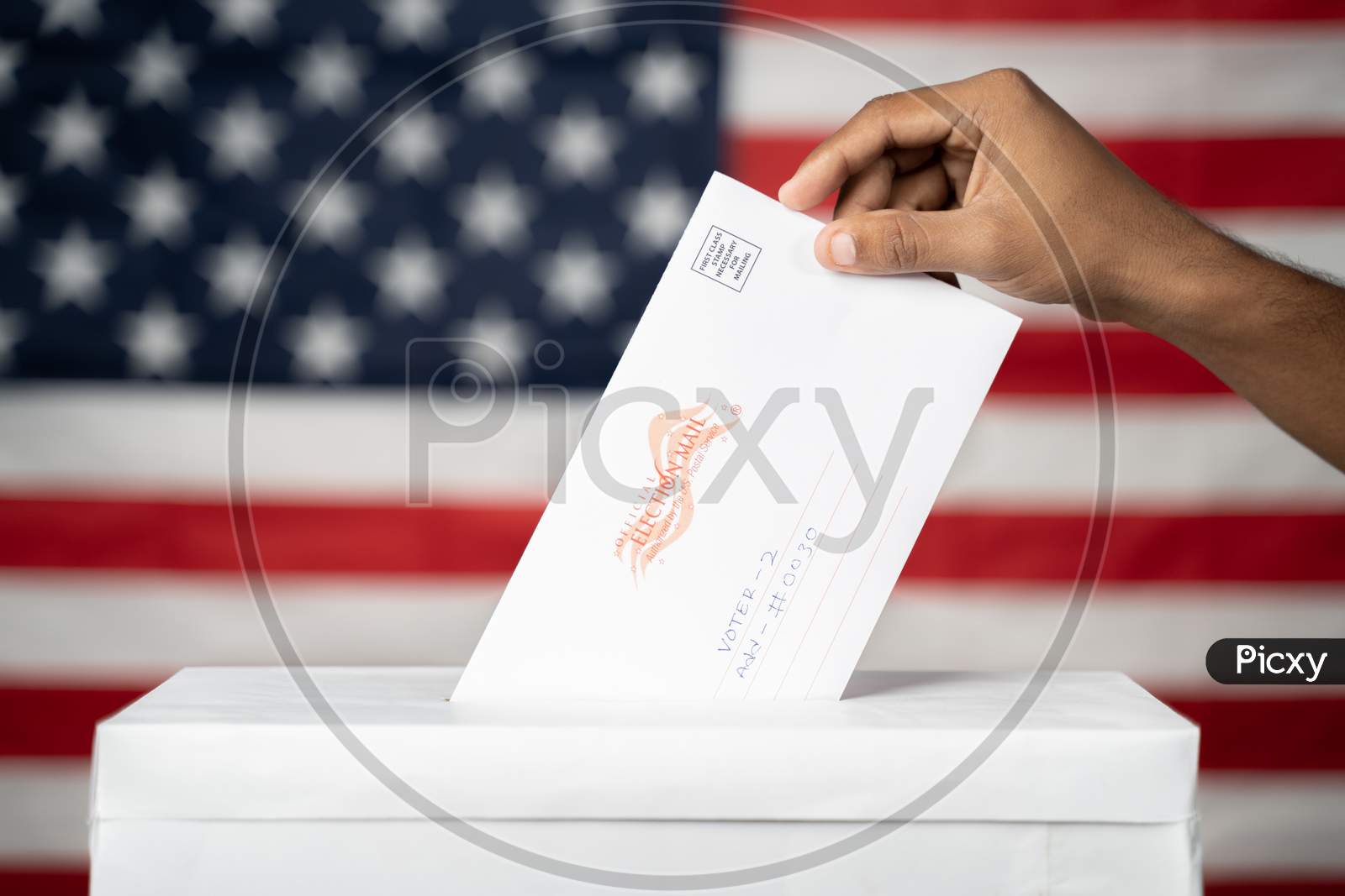 Maski, India 14 September, 2020 : Concept Of Mail In Vote At Us Election - Hands Dropping Mail Inside The Ballot Box With Us Flag As Background.