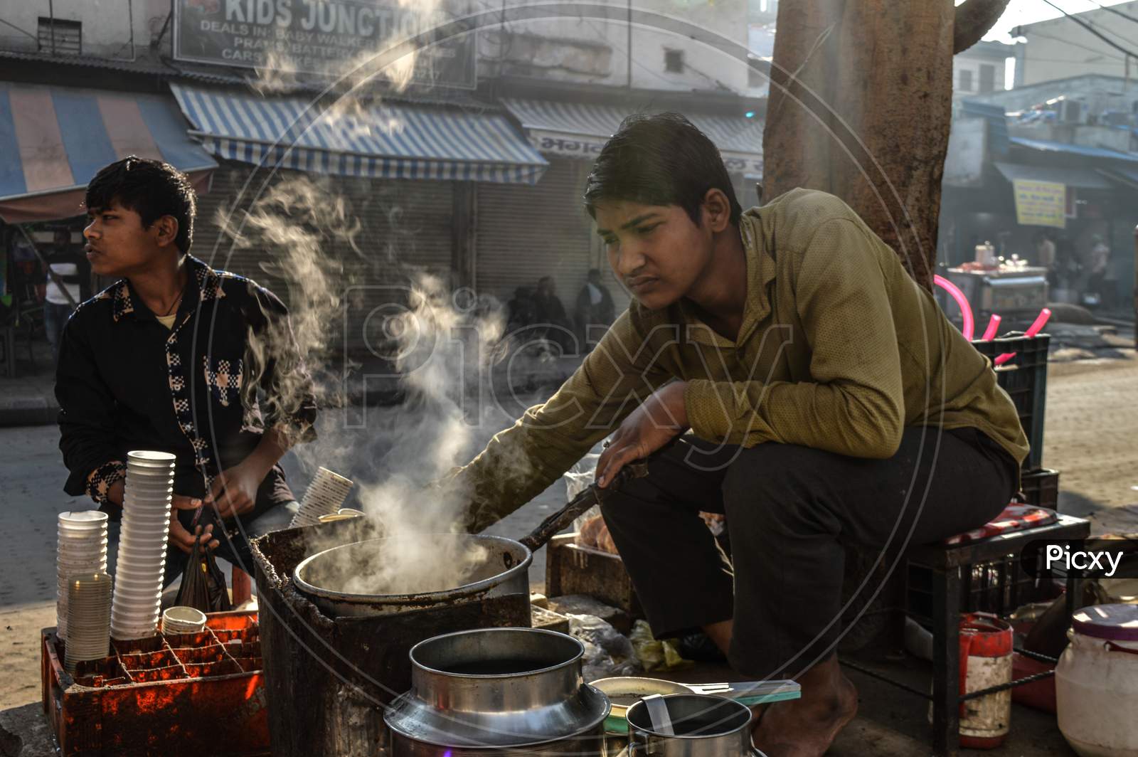 Indian Boy Making Tea At Street Of Chandni Chowk At Morning, Smoke
