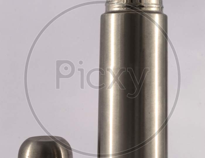 Stainless Steel Vacuum Flask Isolated On The White Background