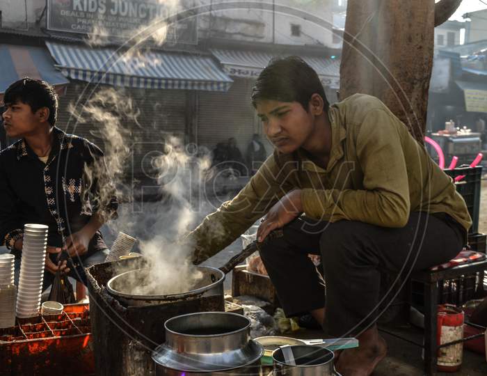Indian Boy Making Tea At Street Of Chandni Chowk At Morning, Smoke