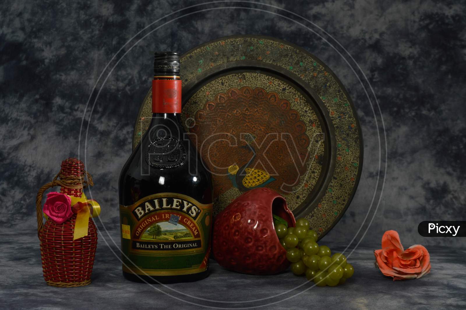Still Life With Baileys, Grapes, Flower Isolated On The Cloth Background With Art Work