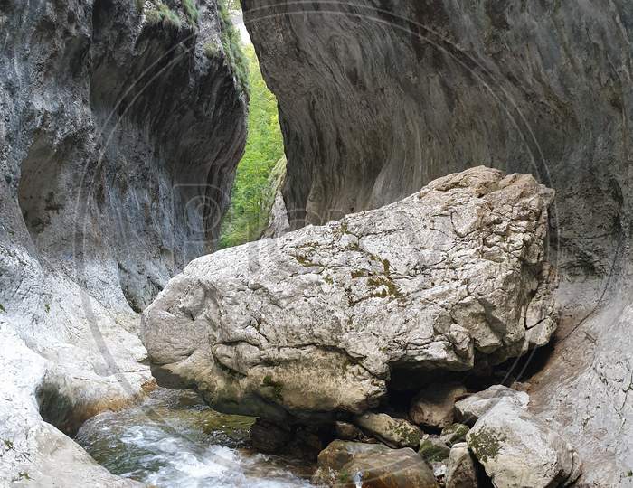 Limestone Boulder In Cheile Rametului River Gorges