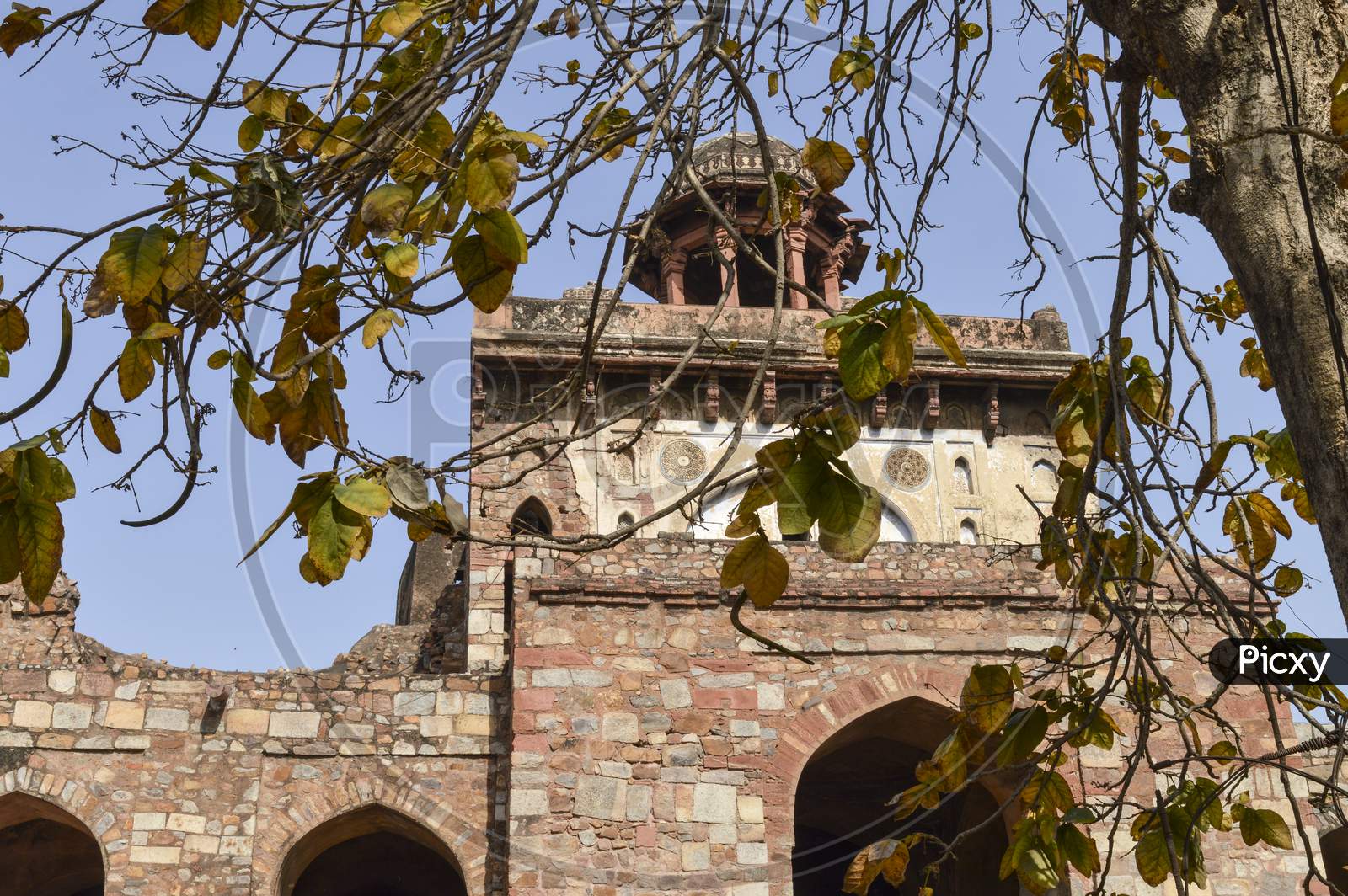 A Mesmerizing View Of Architecture Of Small Tomb At Old Fort From Side Lawn.