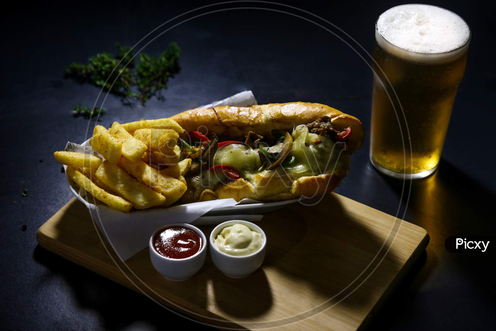 Beef focaccia with chips and beer glass
