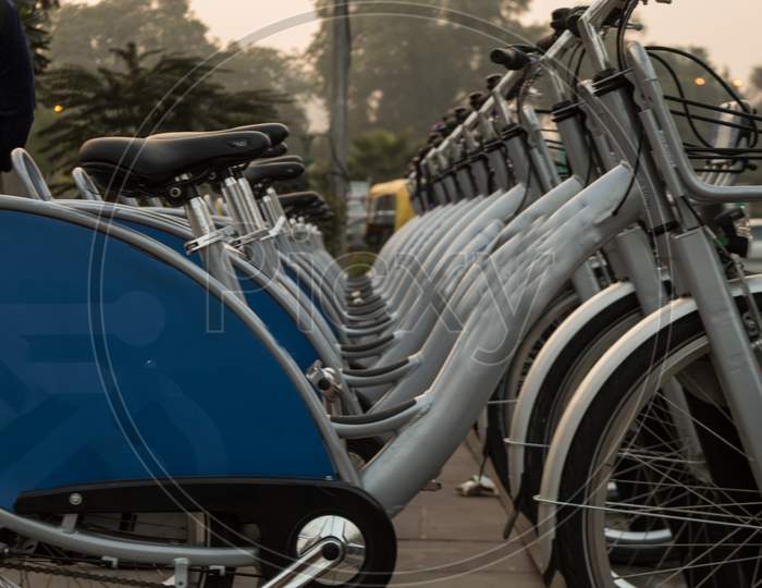 Indian Smart Bikes Stand On The Side Of The Road At Evening