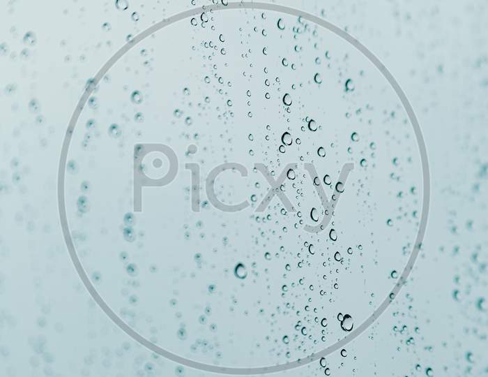 Vertical Background Of Some Rain Drops Over A Crystal Surface