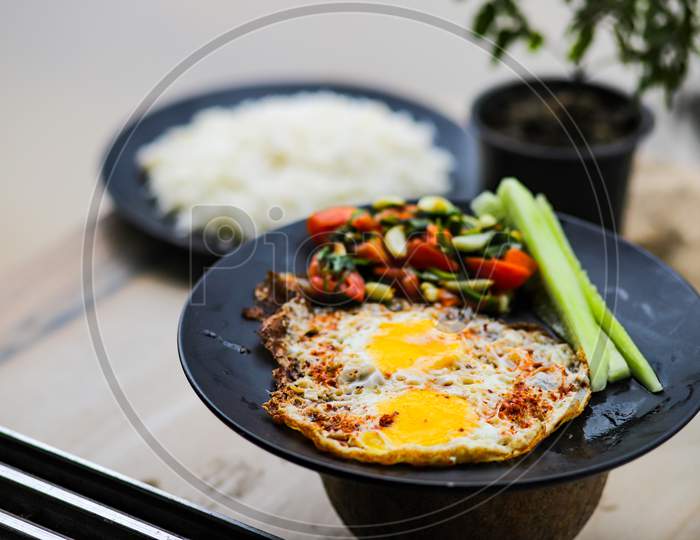 Pouched egg, mixed vegetables and rice