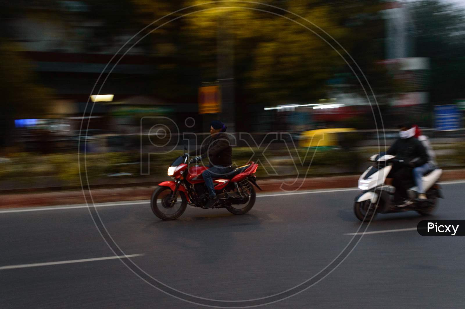 Panning Technique Of Two Biker Going To Work At Morning On The Road