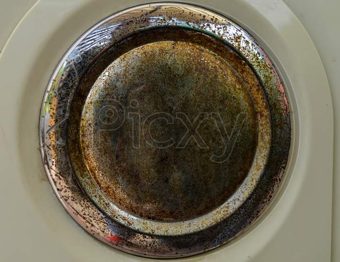 A Rustic Piece Of Steel Isolated On White Plastic.