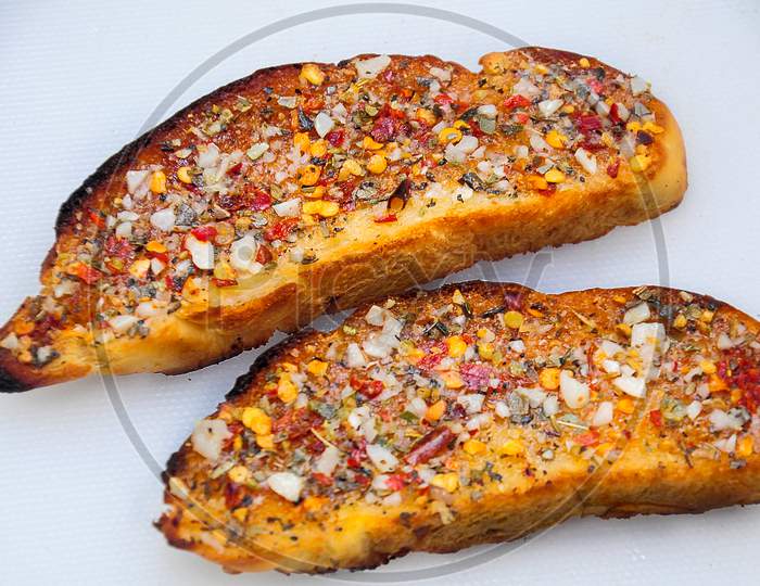 Garlic bread, garlic nan Tasty bread with garlic &herbs on kitchen table