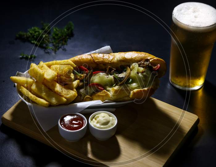Beef focaccia with chips and beer glass