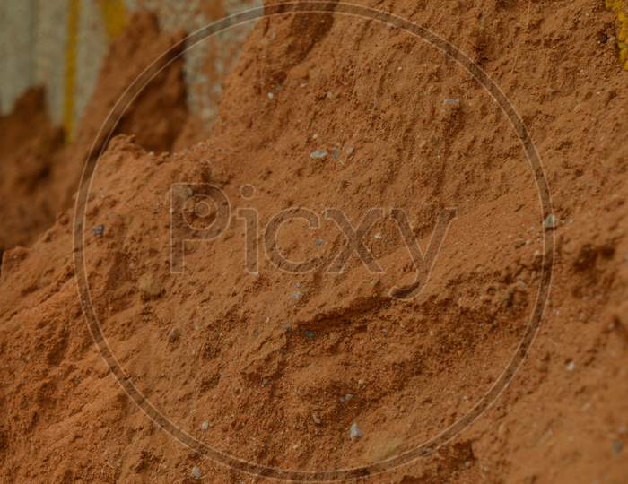 A Small Sand Mountain On The Side Of Road In Polluted City, Micro Shot.
