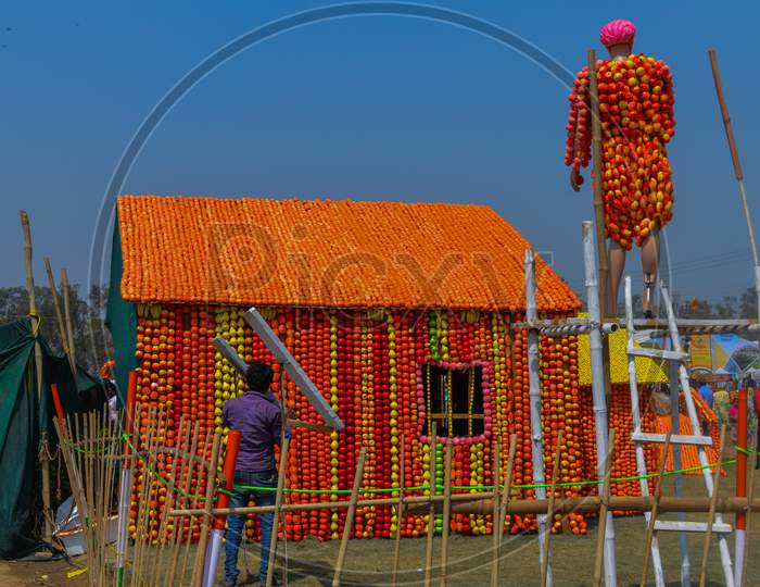 A Statue Of Indian Home And Indian Farmer Which Is Made Of Cotton And Fruit Showcase On The Agriculture Festival, Pusa, New Delhi.