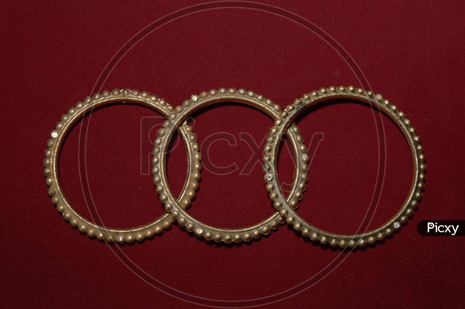 A Antique Handmade Indian Bangles Isolated On Red Background For Beautiful Hands
