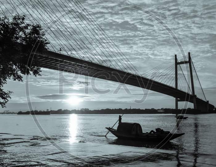 A view from princep ghat with vidyasagar setu and boat at evening time