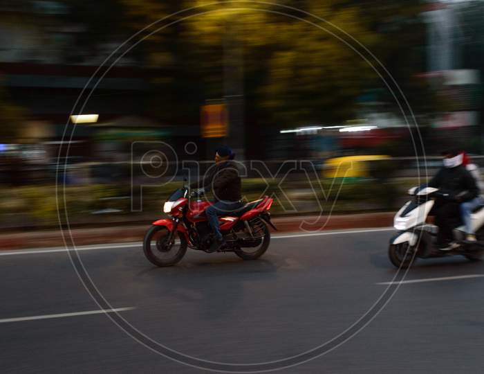 Panning Technique Of Two Biker Going To Work At Morning On The Road