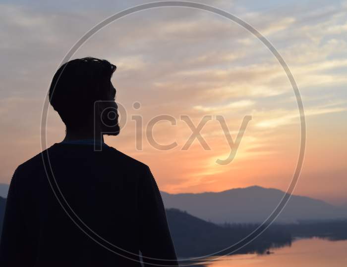 A man watching beautiful sunset