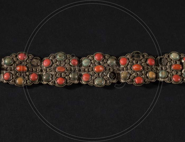 A Beautiful Antique Indian Bracelet Isolated On Black Background With Diamond And Stone