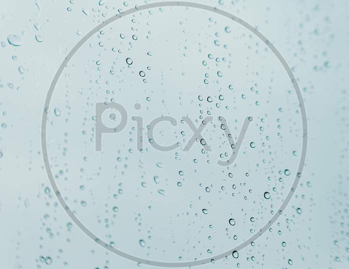 Horizontal Background Of Some Rain Drops Over A Crystal Surface