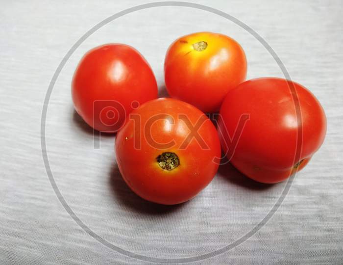 The tomato is the edible, often red berry of the plant Solanum lycopersicum, commonly known as a tomato plant. The species originated in western South America and Central America
