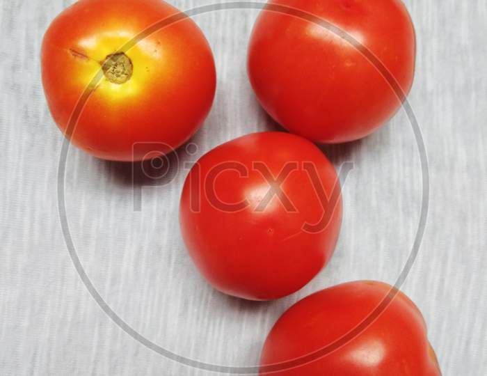 The tomato is the edible, often red berry of the plant Solanum lycopersicum, commonly known as a tomato plant. The species originated in western South America and Central America