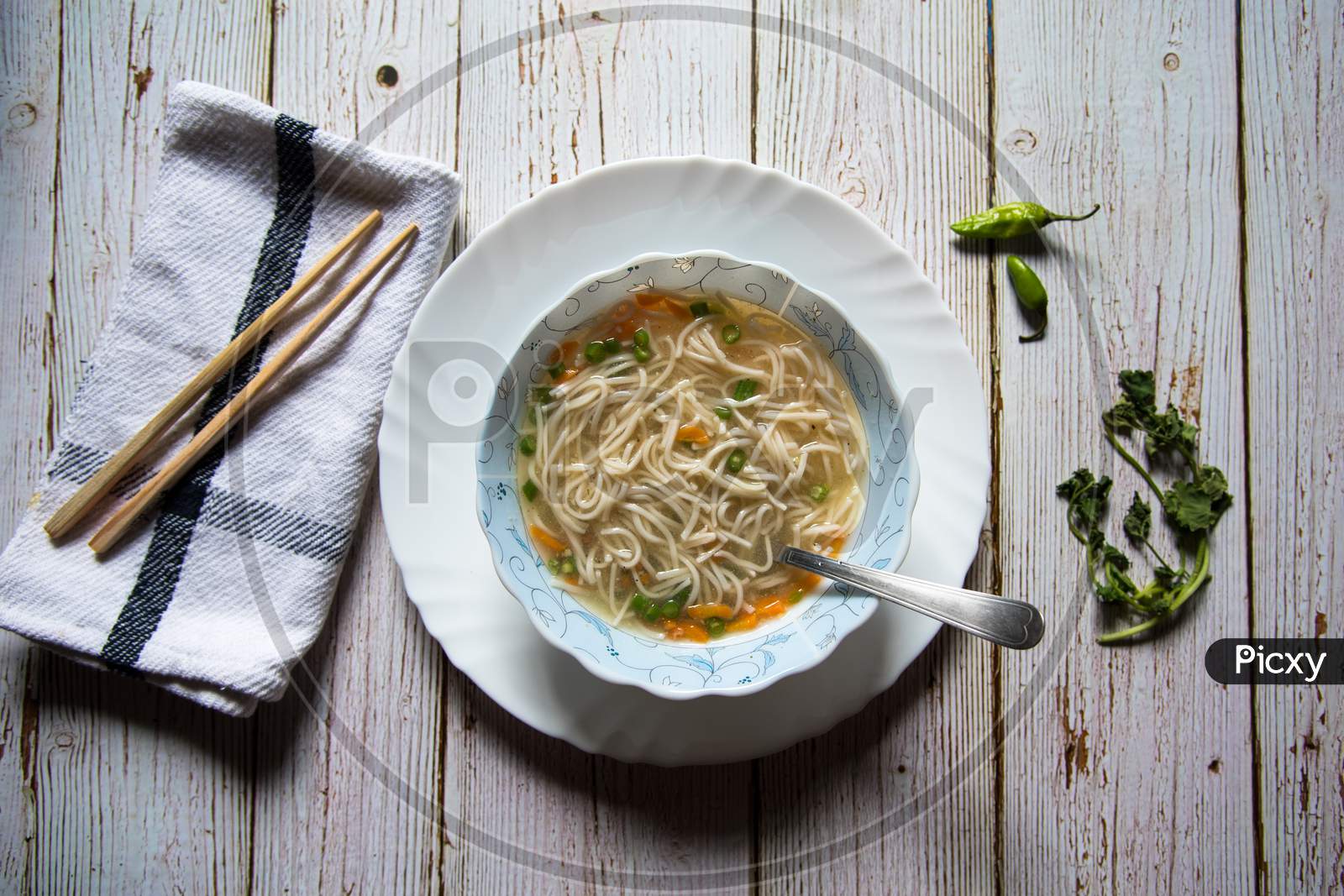 Top view of Asian delicacy thukpa in a bowl with chopsticks