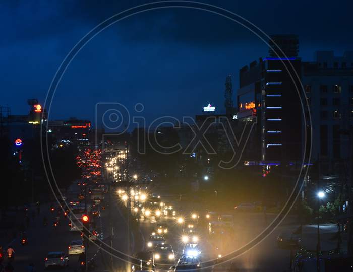 Vehicles move on road as dark clouds hover around the city in Miyapur, Hyderabad, September, 16,2020.
