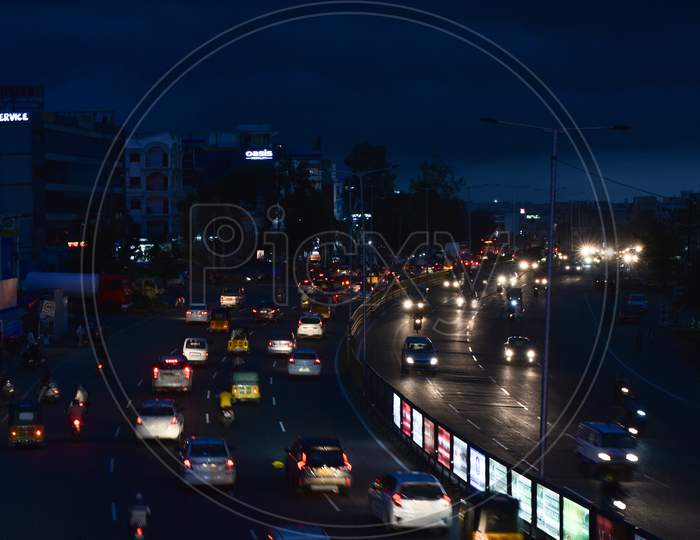 Vehicles move on road as dark clouds hover around Miyapur area in Hyderabad , september 16,2020.