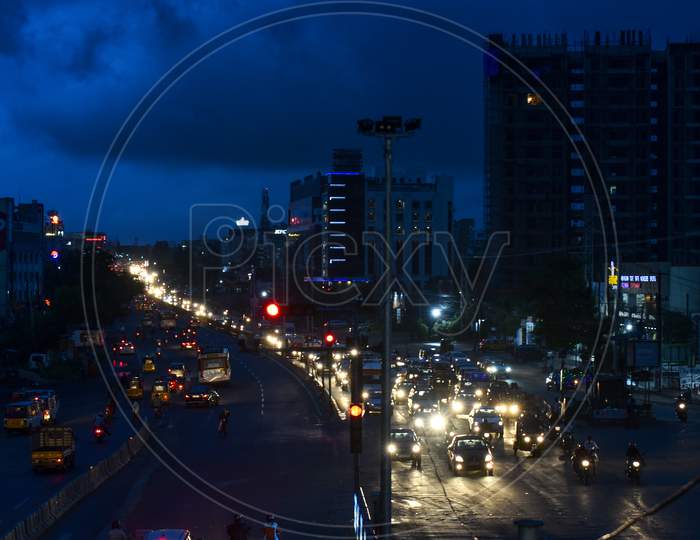 Vehicles move on road as dark clouds hover around the city in Miyapur, Hyderabad, September, 16,2020.