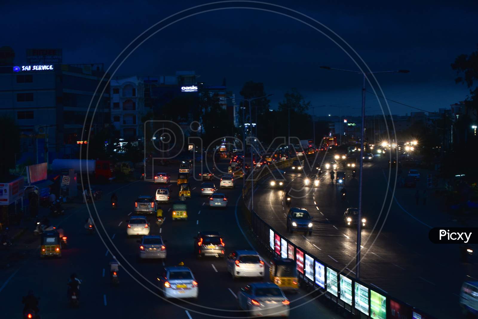 Vehicles move on road as dark clouds hover around Miyapur area in Hyderabad , september 16,2020.