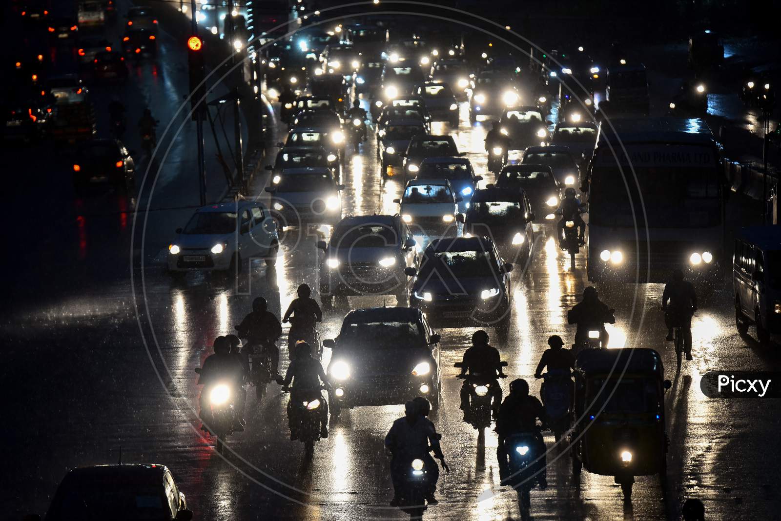 Vehicles move on road as it rains heavily in Hyderabad on September 16,2020