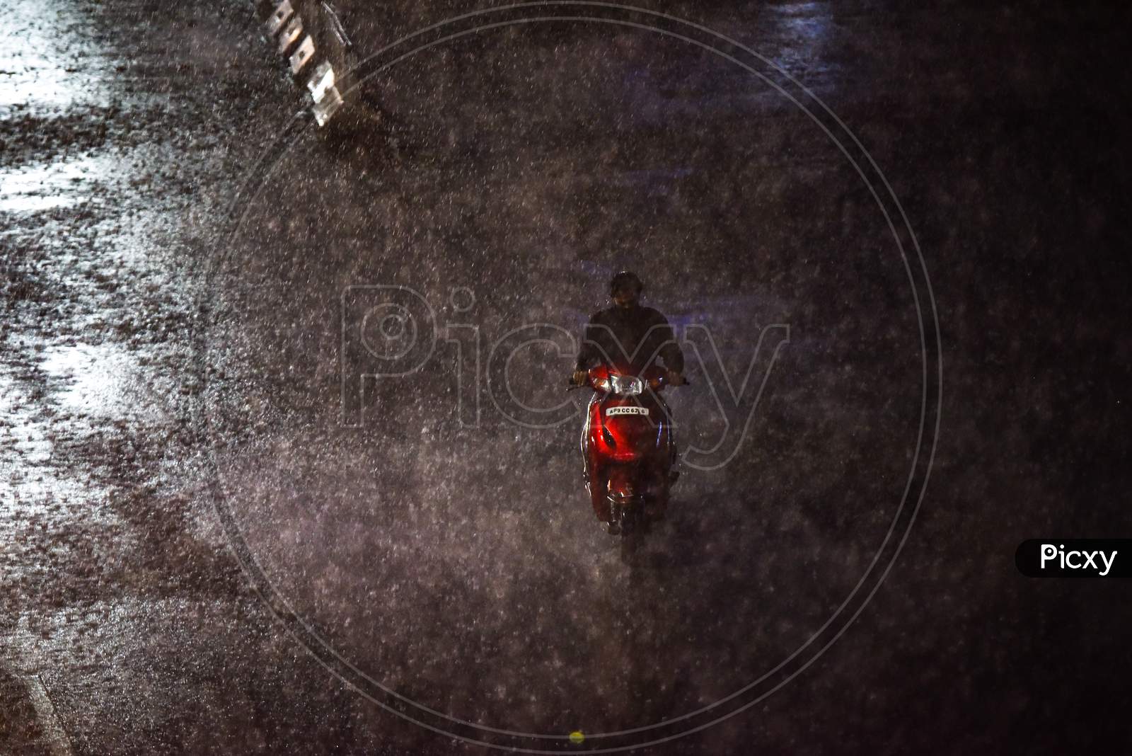 a motorist wades through Heavy rain in Hyderabad on September 16, 2020