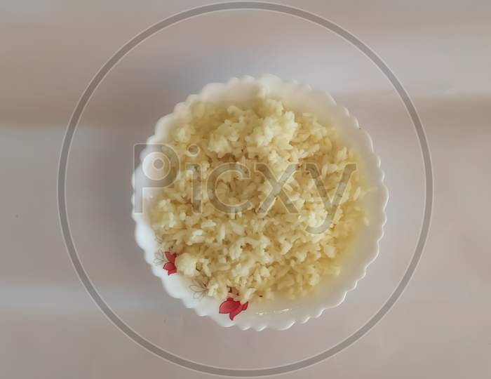 Closeup Of Boiled Rice In A Bowl Isolated On A White Surface