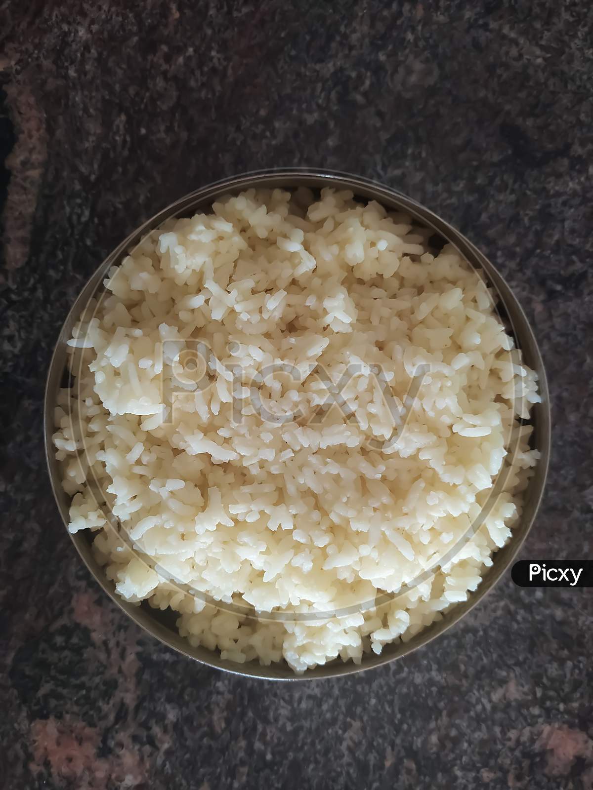 Closeup Of Boiled Rice In A Bowl Isolated On A Floor
