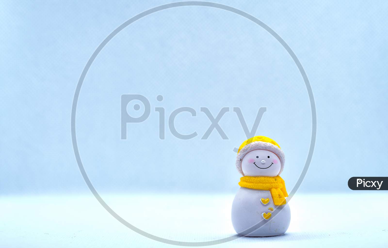 Tourism And Travel Concept: Miniature Little Snowman Standing Alone