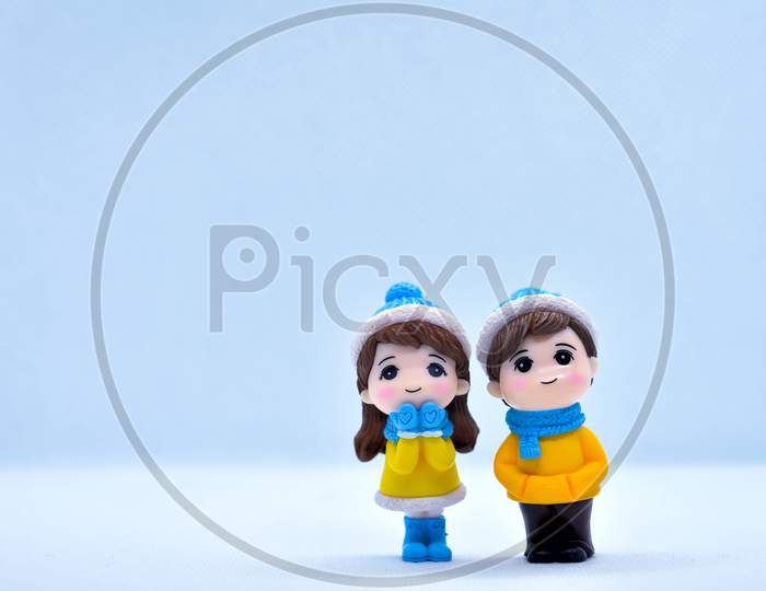 Tourism And Travel Concept: Miniature Little Couple And Girl Standing In Isolated Background