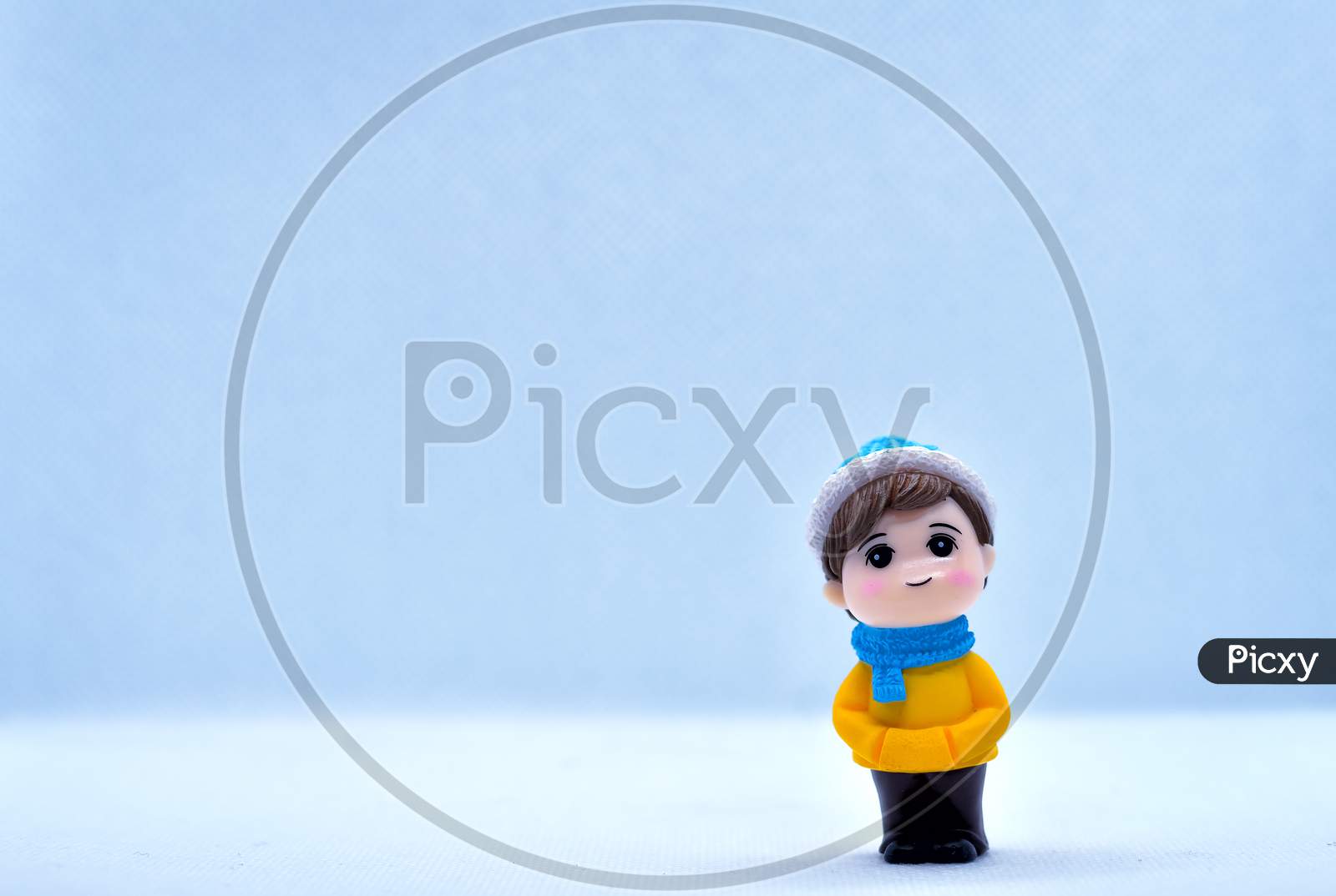 Tourism And Travel Concept: Miniature Little Boy Standing In Isolated Background