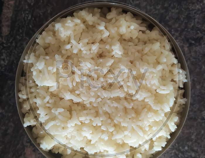 Closeup Of Boiled Rice In A Bowl Isolated On A Floor