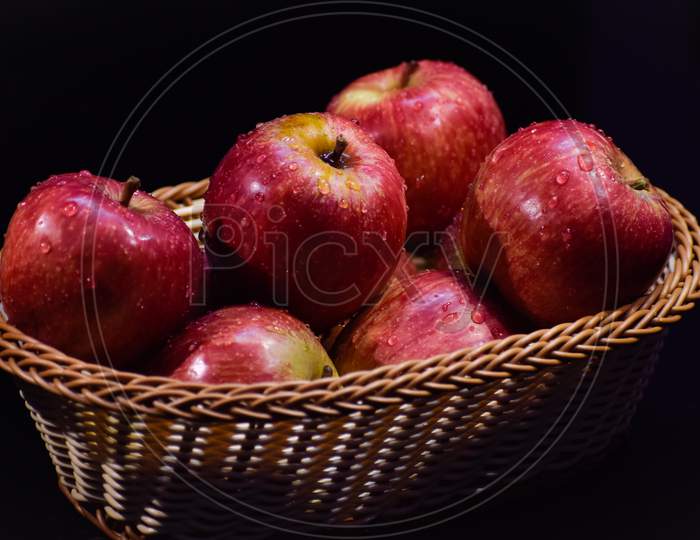 Apples in basket. Apple fruits.