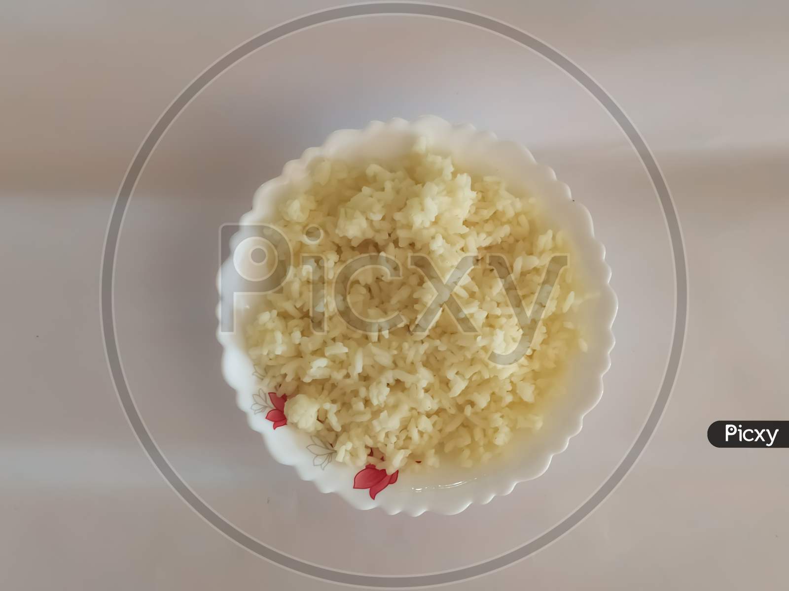 Closeup Of Boiled Rice In A Bowl Isolated On A White Surface