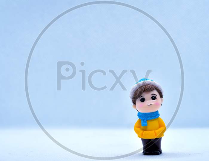 Tourism And Travel Concept: Miniature Little Boy Standing In Isolated Background