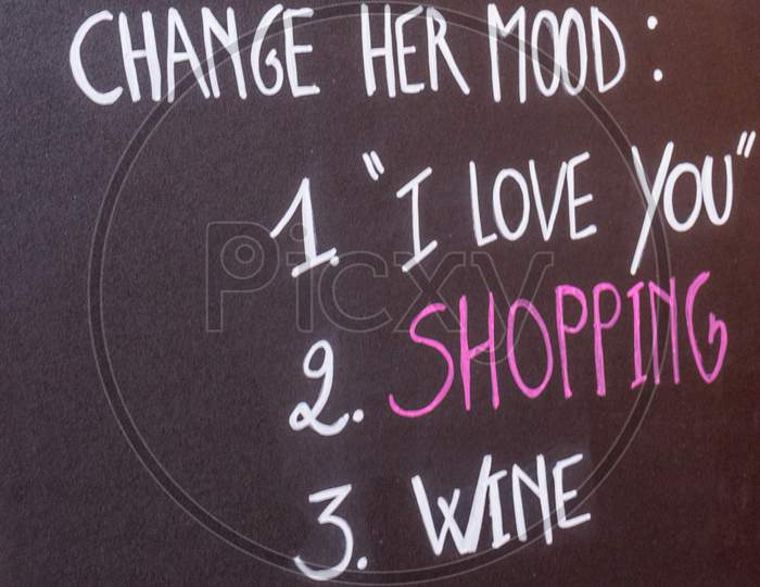 Belgium, Bruges, A Close Up Of A Blackboard With Shopping Wine And Love