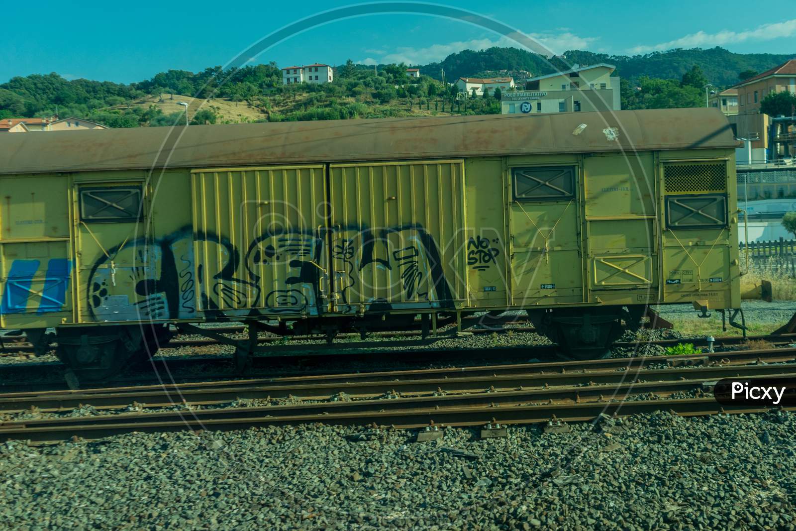 Italy - 28 June 2018: The Graffiti On Trenitalia In The Italian Outskirts Track