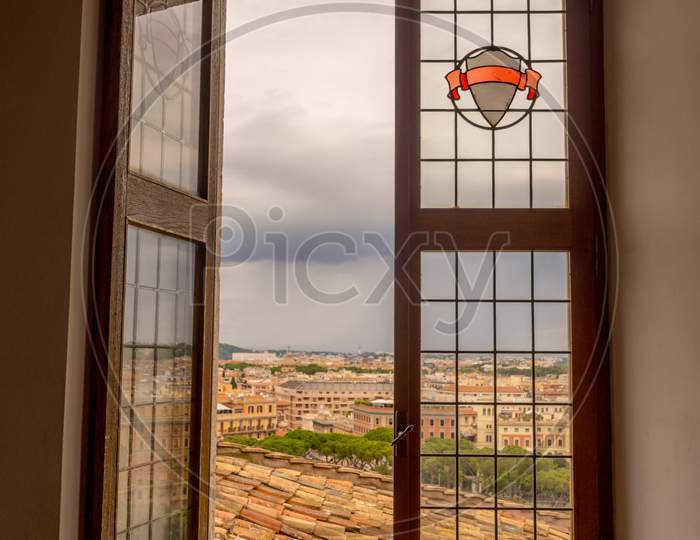 A Partial Opened Window Staring Into City