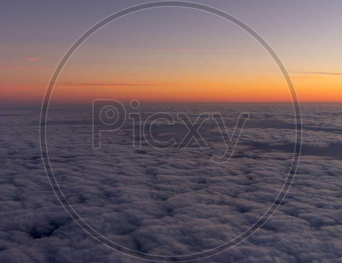 Netherlands, A Sunset Over A Body Of Clouds