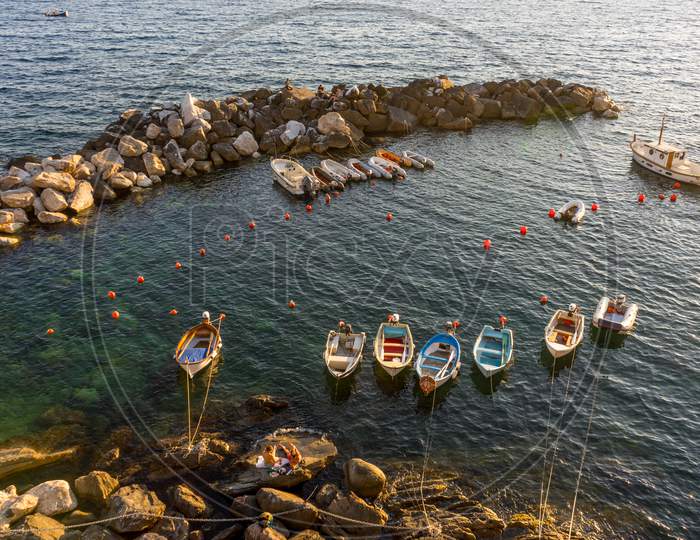Boats And Yachts On The Ocean During Sunset, Italian Riviera Of Riomaggiore, Cinque Terre, Italy