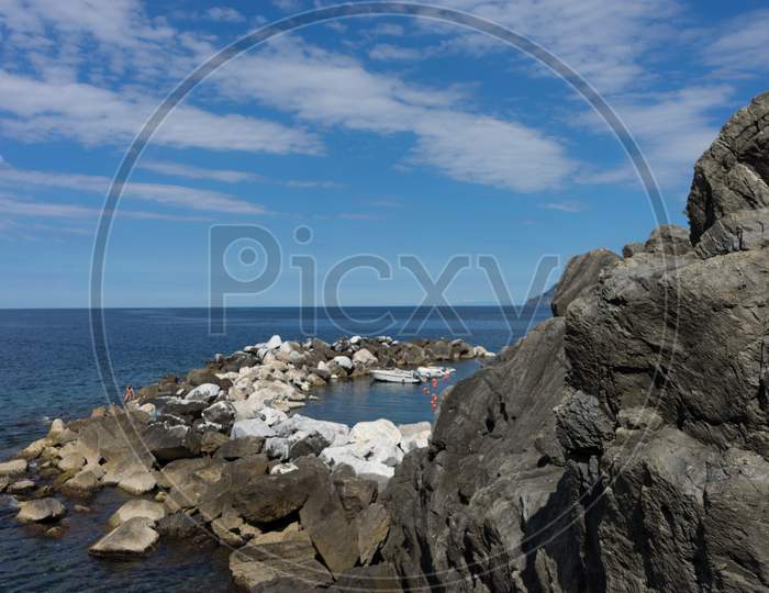 Italy,Cinque Terre,Riomaggiore, A Close Up Of A Rock Near The Ocean