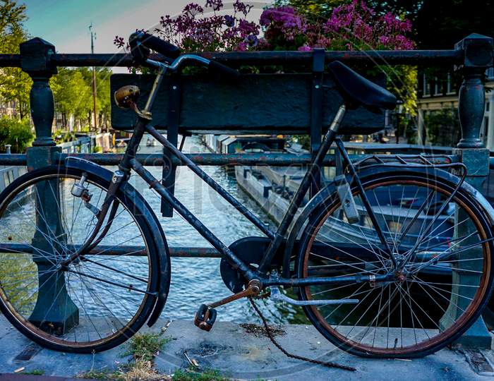 Netherlands, South Holland, A Bicycle Parked On The Side Of The Road